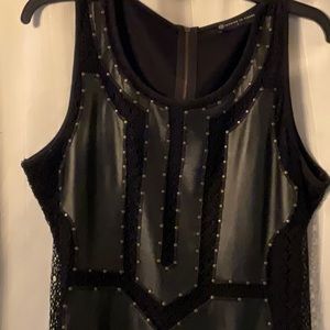 1x cocktail dress.  Fantastic grommet details.